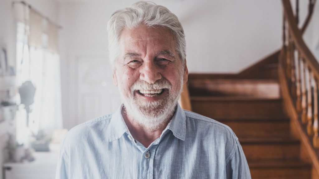 Happy man with full head of hair.